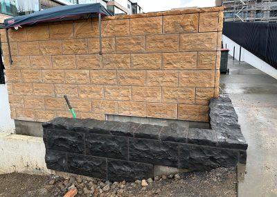 Sandstone cladding being applied